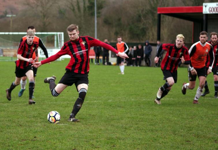 Scott Delaney scores from the spot for Goodwick United who thrashed Saundersfoot Sports